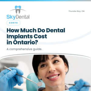 Smiling woman in a dental chair with a dentist holding examination tools, SkyDental Costs blog cover: How Much Do Dental Implants Cost in Ontario? – a comprehensive guide.