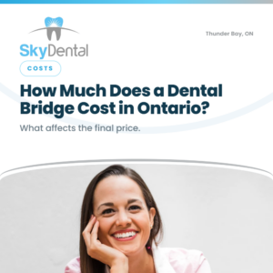 Smiling woman resting her chin on her hand, SkyDental Costs blog cover: How Much Does a Dental Bridge Cost in Ontario? – what affects the final price.
