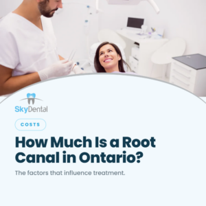 Smiling woman in a dental chair looking up at a male dentist holding an instrument, SkyDental Costs blog cover: How Much Is a Root Canal in Ontario? – the factors that influence treatment.