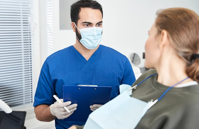Dentist interacting with a patient