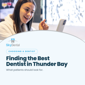 Smiling woman pointing at her smartphone screen, SkyDental Choosing a Dentist blog cover: Finding the Best Dentist in Thunder Bay – what patients should look for.