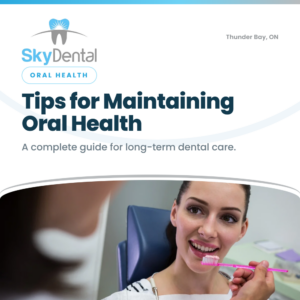 Smiling woman in the dental chair holding a pink toothbrush, SkyDental Oral Health blog cover: Tips for Maintaining Oral Health – a complete guide for long-term dental care."