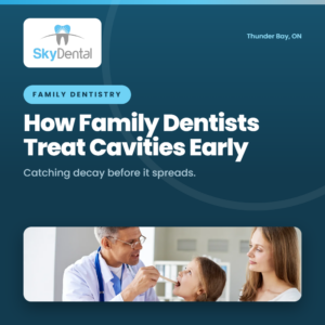 Dentist examining young girl's teeth with her mother nearby - how family dentists treat cavities early, Sky Dental Thunder Bay