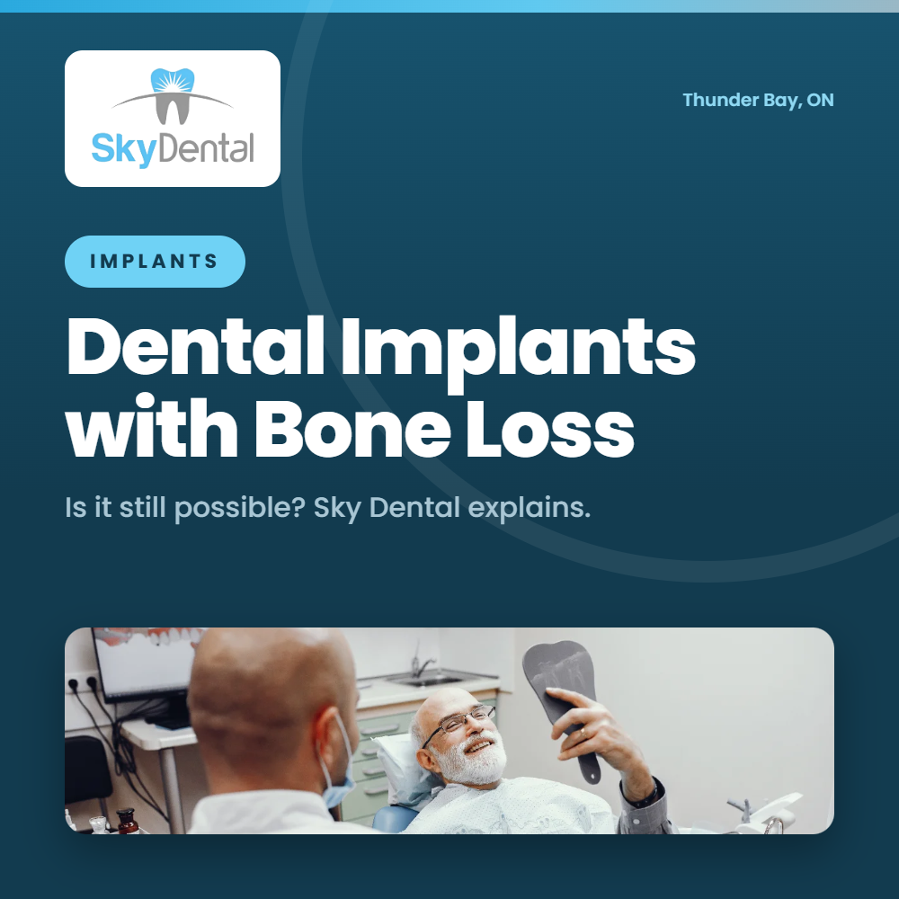Smiling older man holding hand mirror during dental consultation - dental implants with bone loss, is it still possible, Sky Dental Thunder Bay